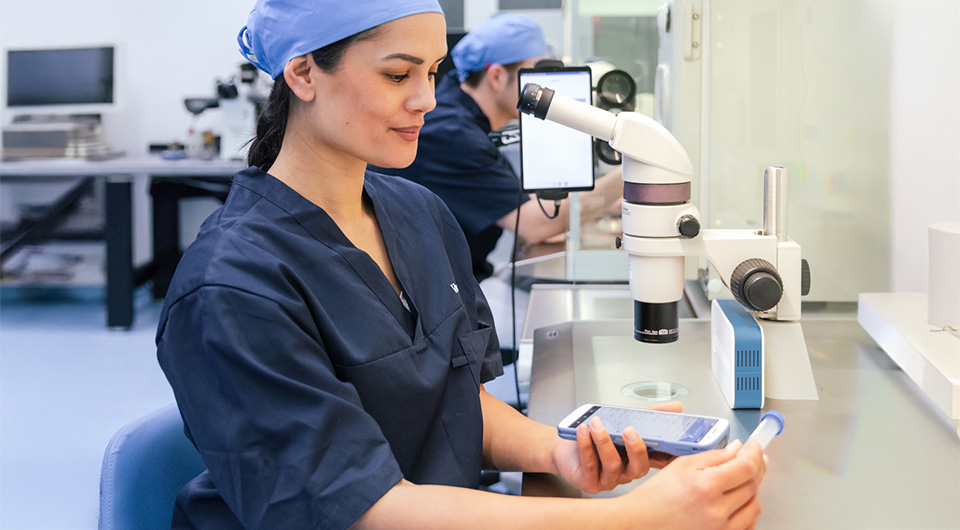 eWitness electronic witnessing system featured in IVF lab setting with flexible barcode scanner and RFID reader